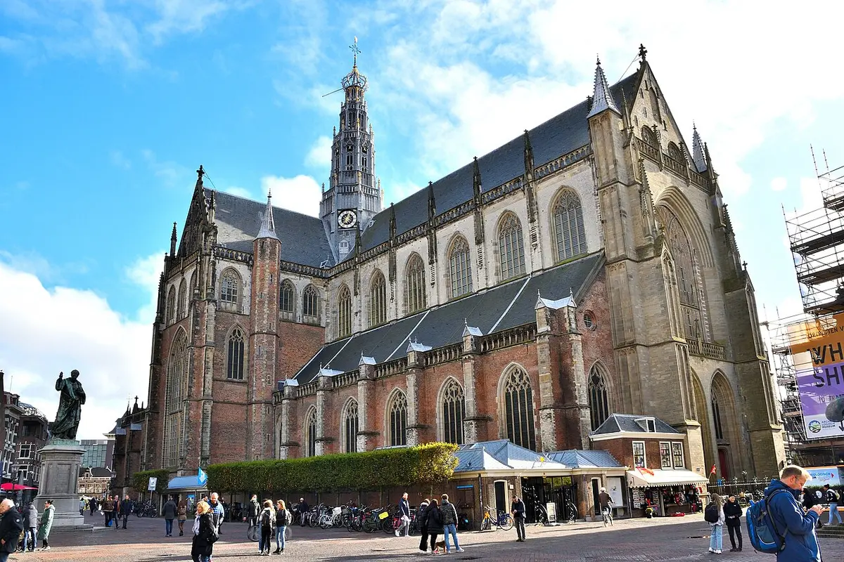 The Grote Kerk of St. Bavo in Haarlem, a Gothic church with a slender tower, over the market square
