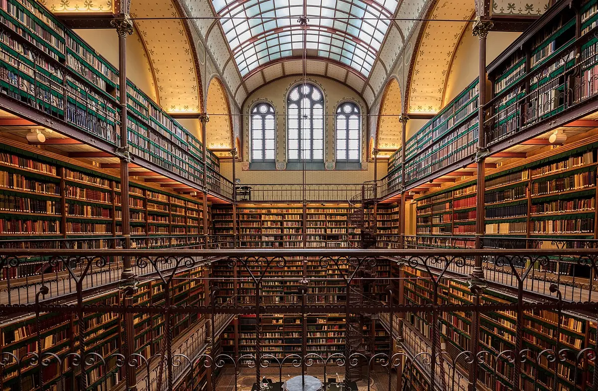 The library inside the Rijksmuseum, four floors of books on iron galleries under a glass roof