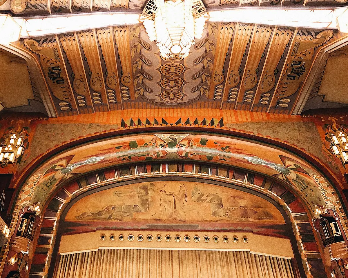 The painted and gilded stage arch and ceiling of the Tuschinski cinema