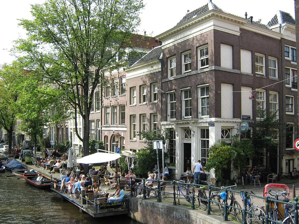 Canal houses along the Egelantiersgracht, with a café terrace on the water