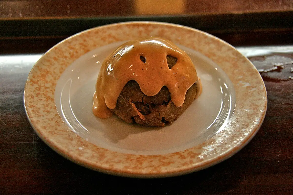 A bomba, a fried ball of potato stuffed with meat, under allioli and spicy sauce