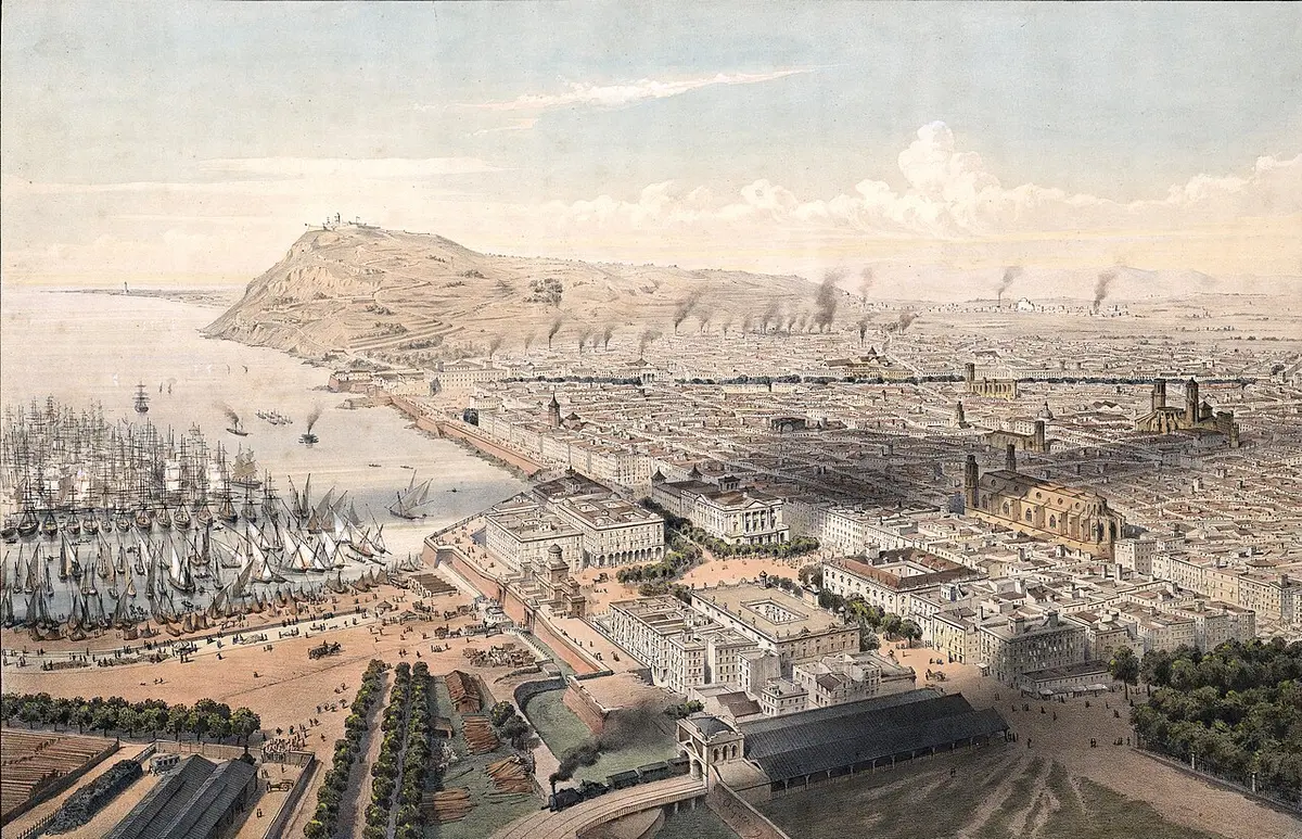 Bird’s-eye lithograph of Barcelona in the 1850s: the port full of sailing ships, the sea wall, the packed old town and Montjuïc beyond, with a steam train in the foreground