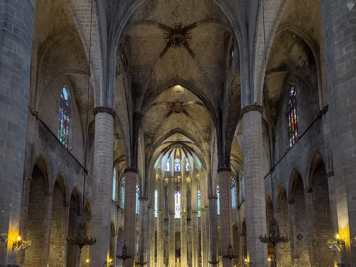 The wide Gothic nave of Santa Maria del Mar, slender octagonal pillars leading to the apse