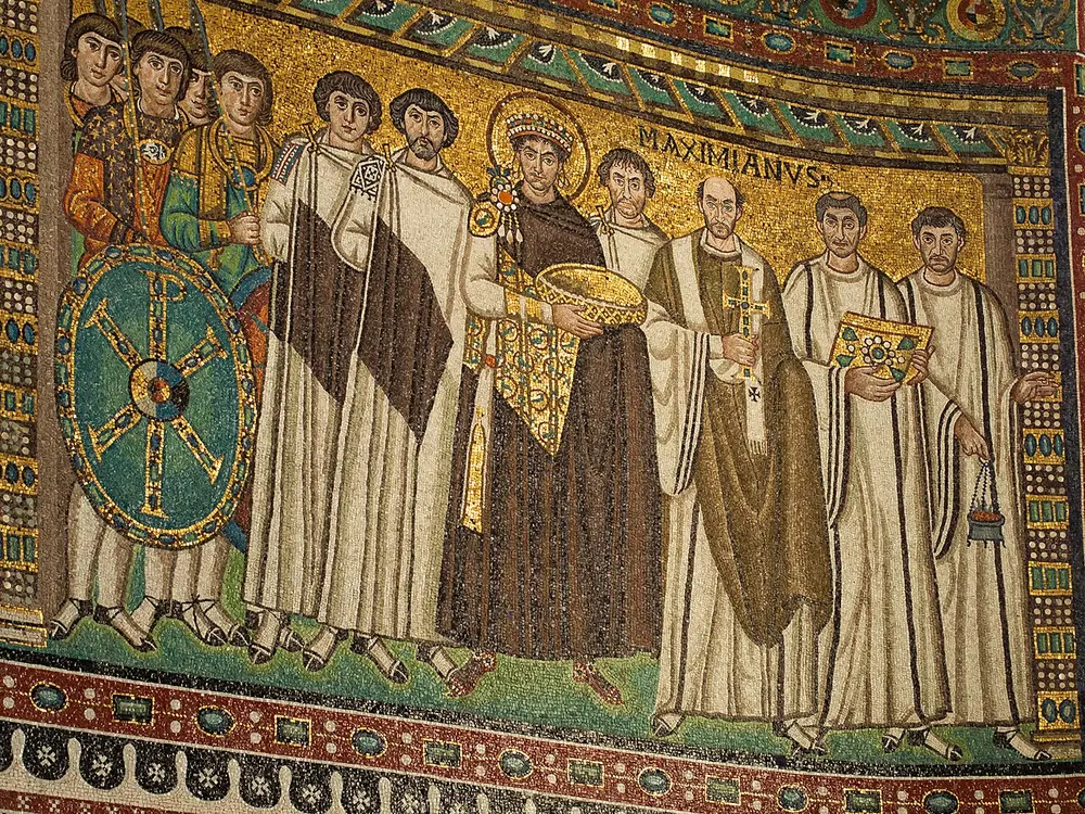 Byzantine mosaic of the emperor Justinian holding a gold bowl among soldiers, courtiers and clergy on a gold ground