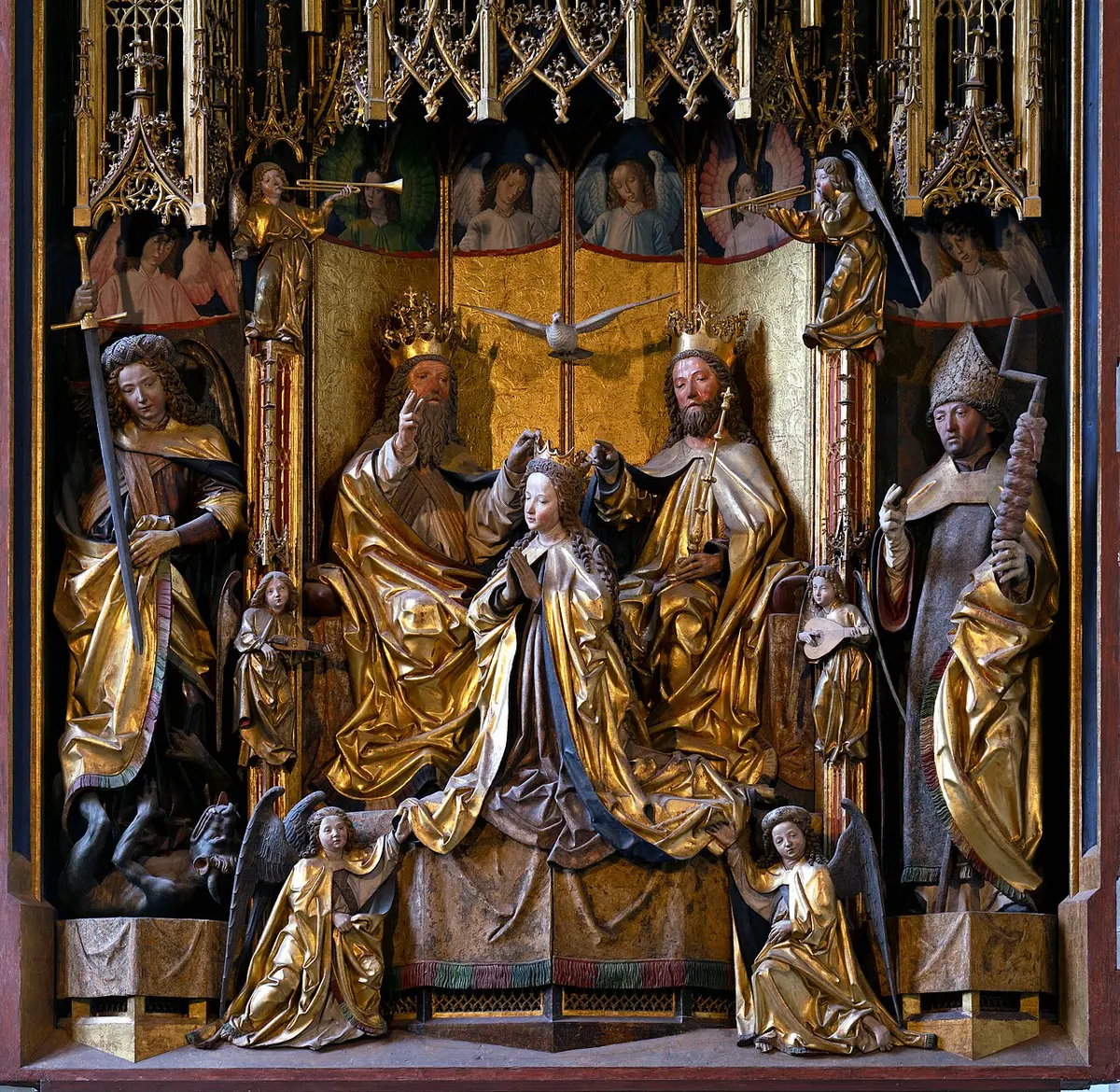 The carved and gilded shrine of Michael Pacher’s altar, the Coronation of the Virgin among saints