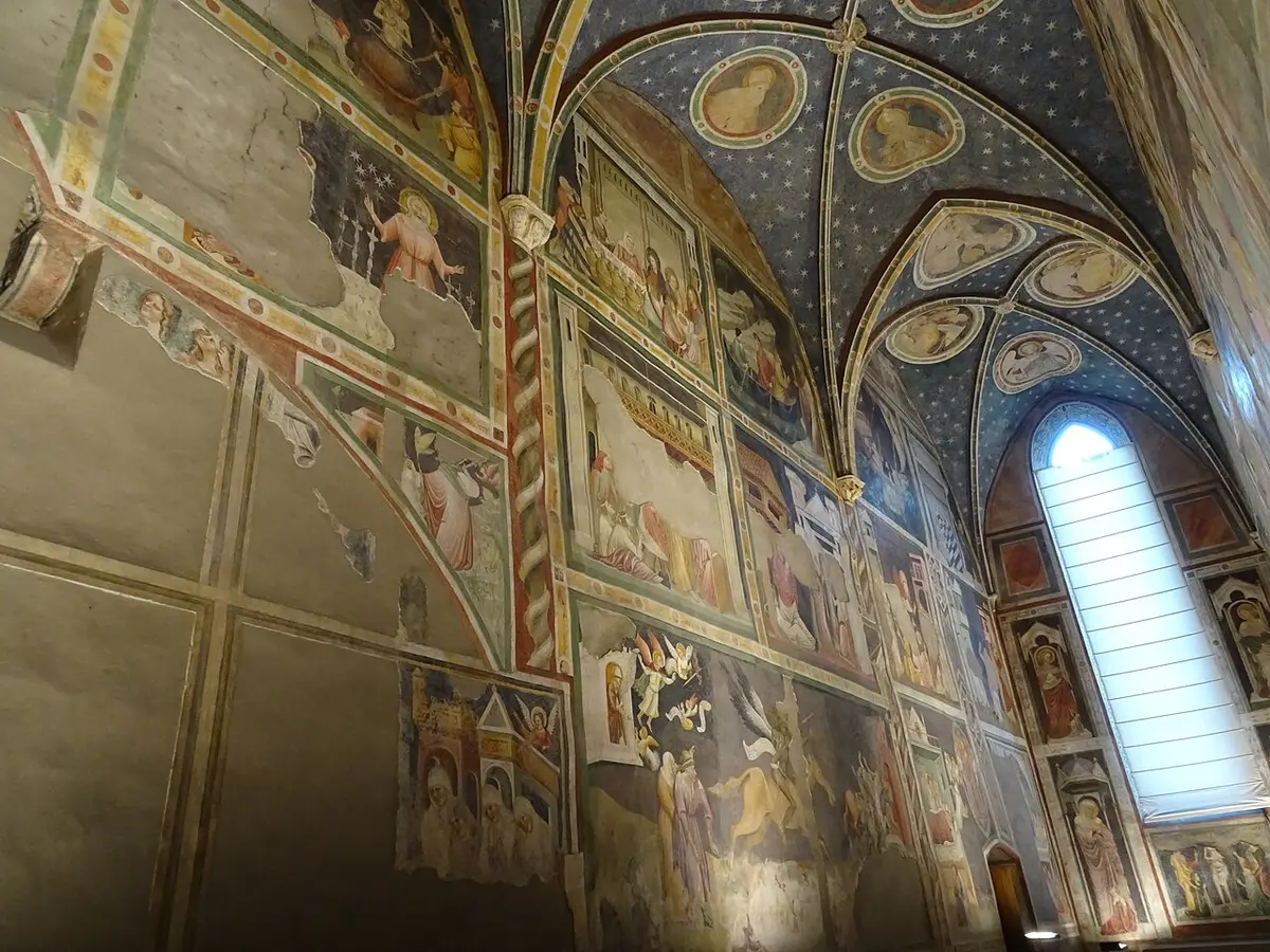 The Chapel of St. John in the Dominican church, its walls covered in frescoes under a blue starry vault