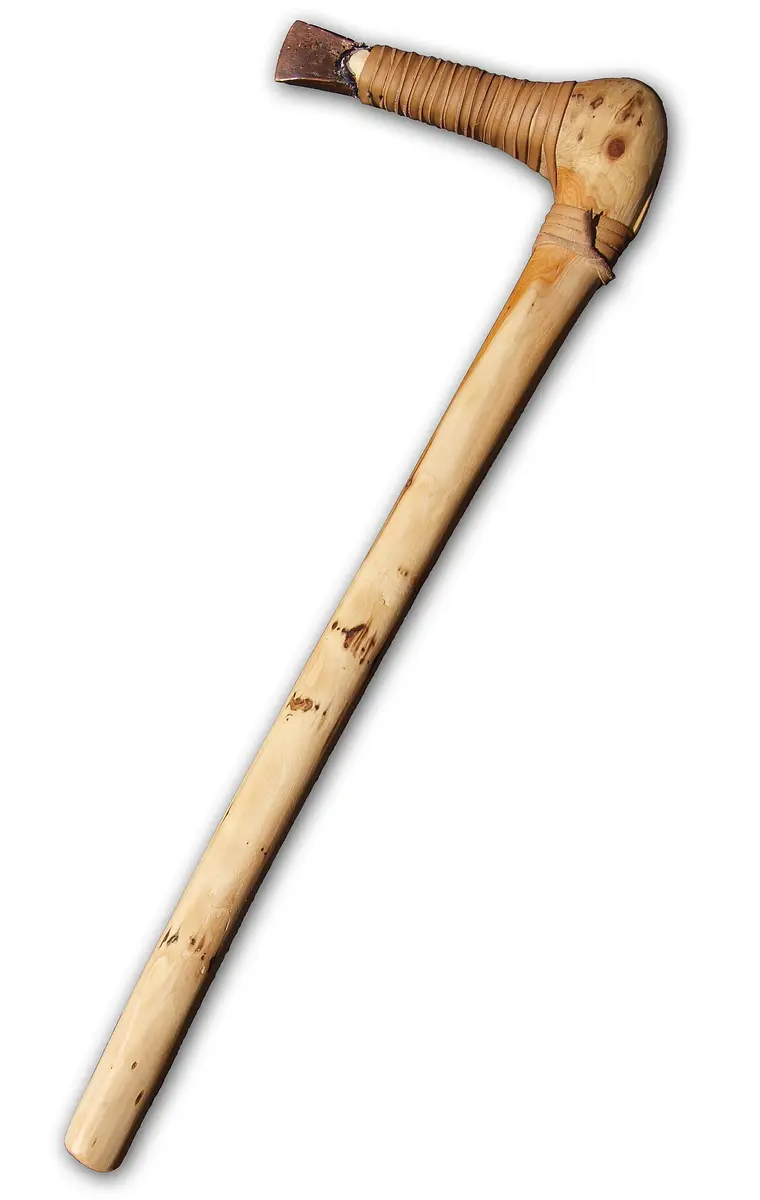 A reconstruction of Ötzi’s axe, a copper blade bound with leather strips into a wooden handle