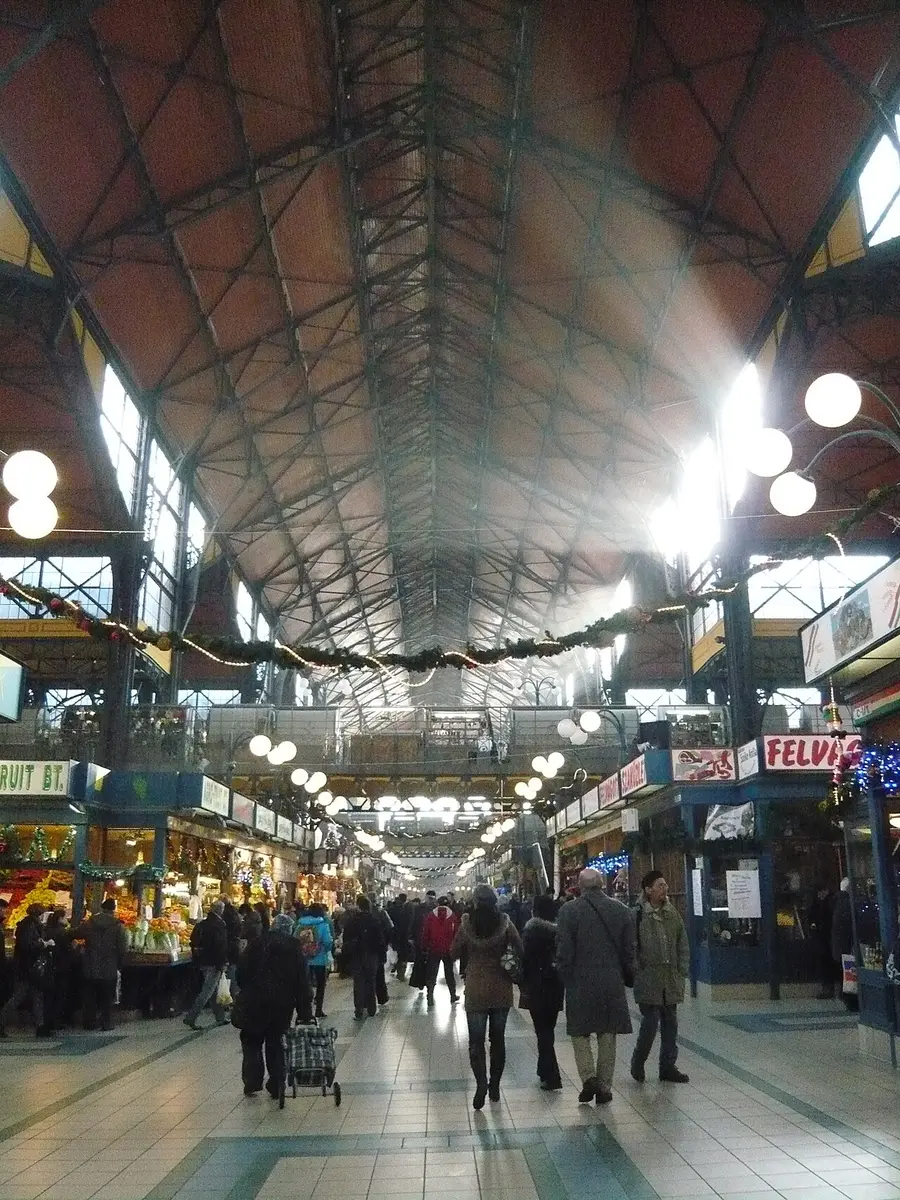 The iron roof and stalls of the Great Market Hall, with winter light streaming in