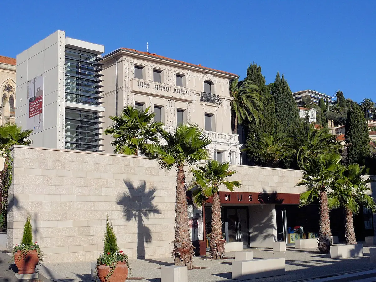 The Musée Bonnard in Le Cannet, a Belle Époque villa with a modern stone extension and palm trees in front