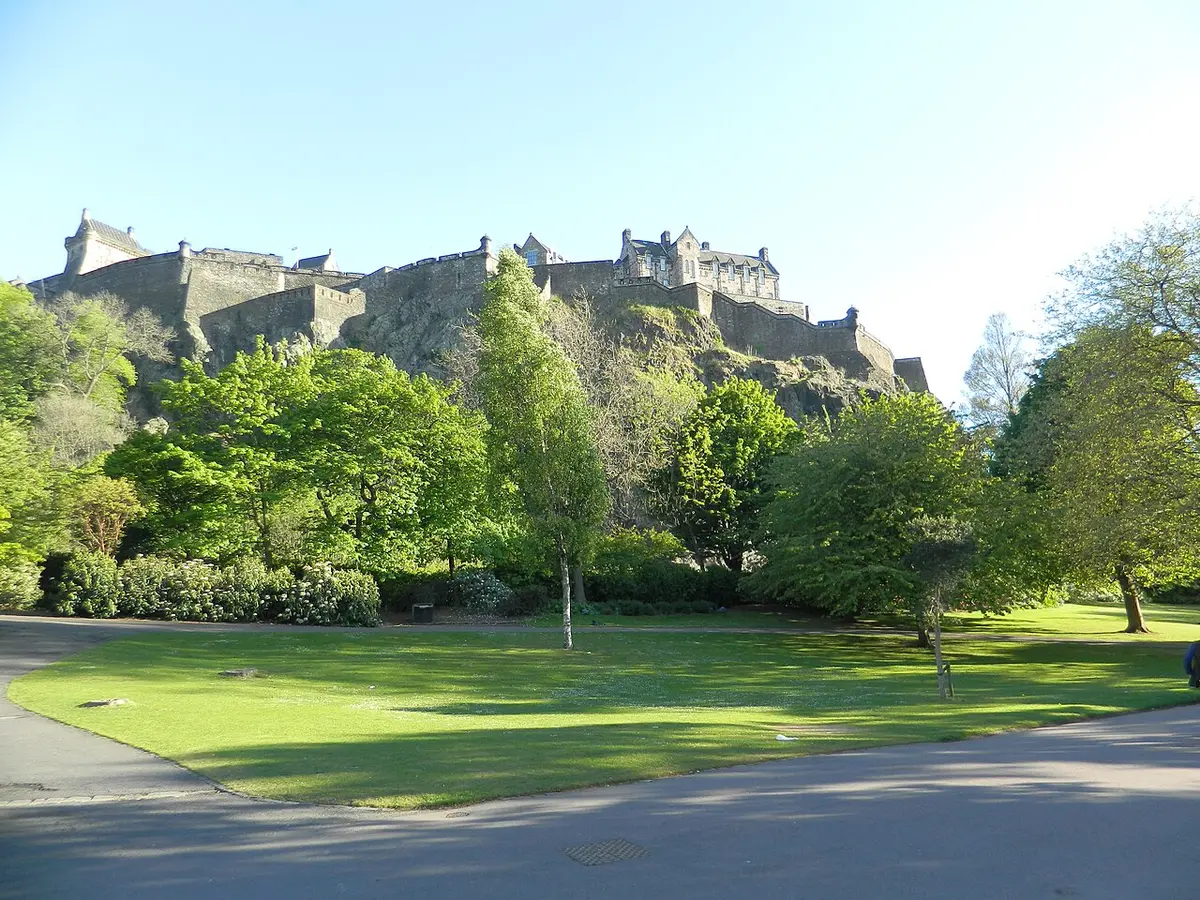 Edinburgh Castle on its crag above the trees and lawns of Princes Street Gardens