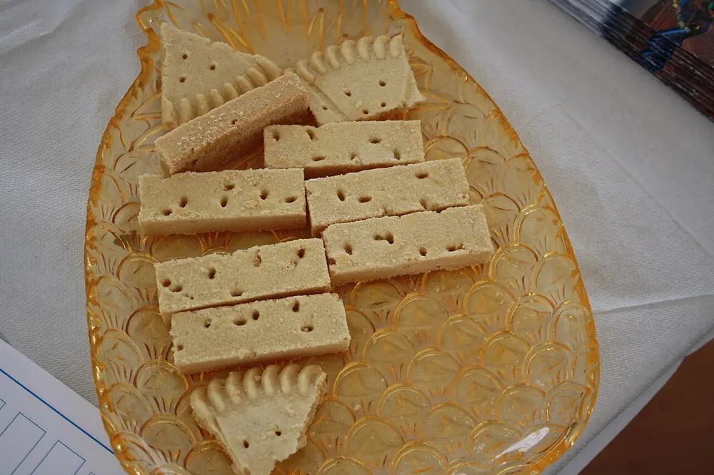 Shortbread fingers and wedges, the petticoat tails, on an amber glass plate