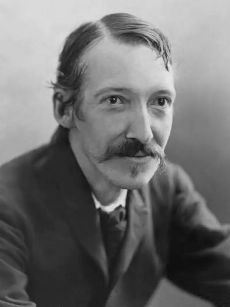 Black and white photograph of Robert Louis Stevenson with a moustache, looking at the camera