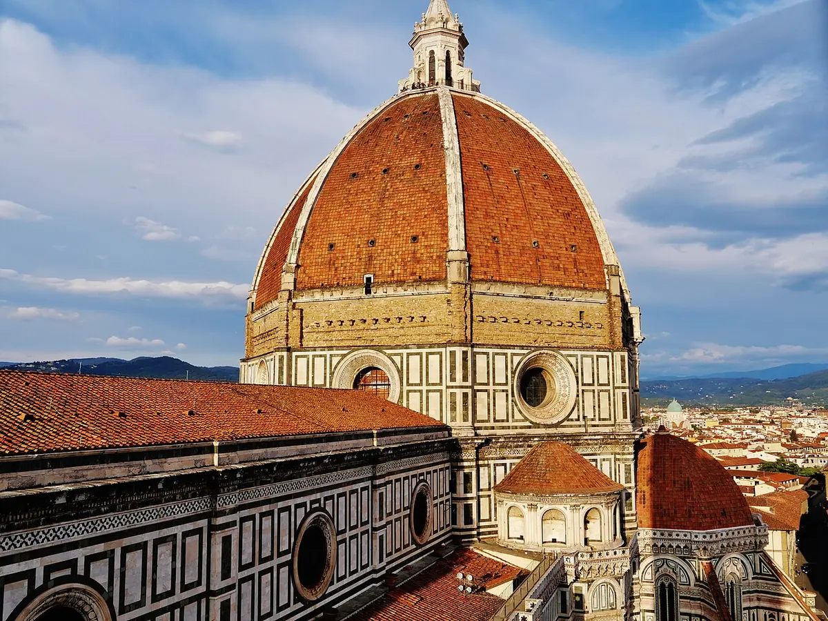 Brunelleschi’s red-tiled dome with its white ribs and lantern, seen from Giotto’s bell tower, the city spread out below