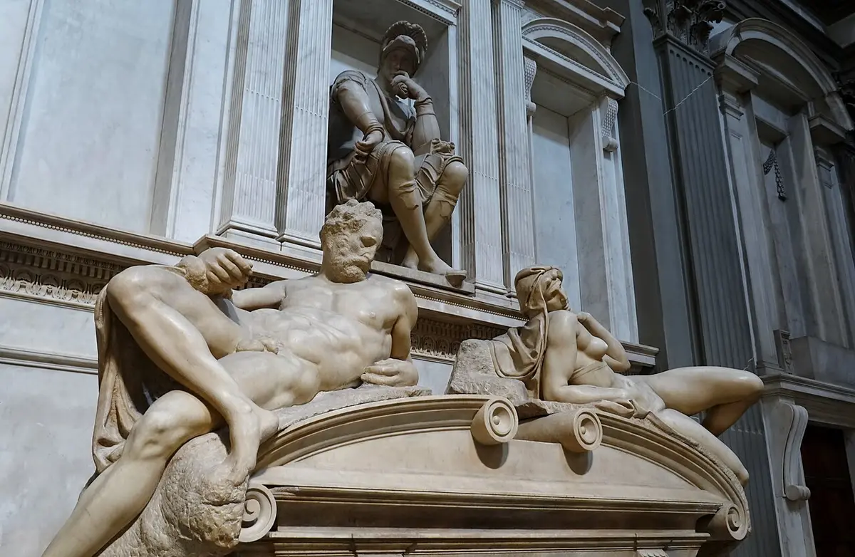 Michelangelo’s marble tomb of Lorenzo de’ Medici, with the reclining figures of Dusk and Dawn below his seated statue