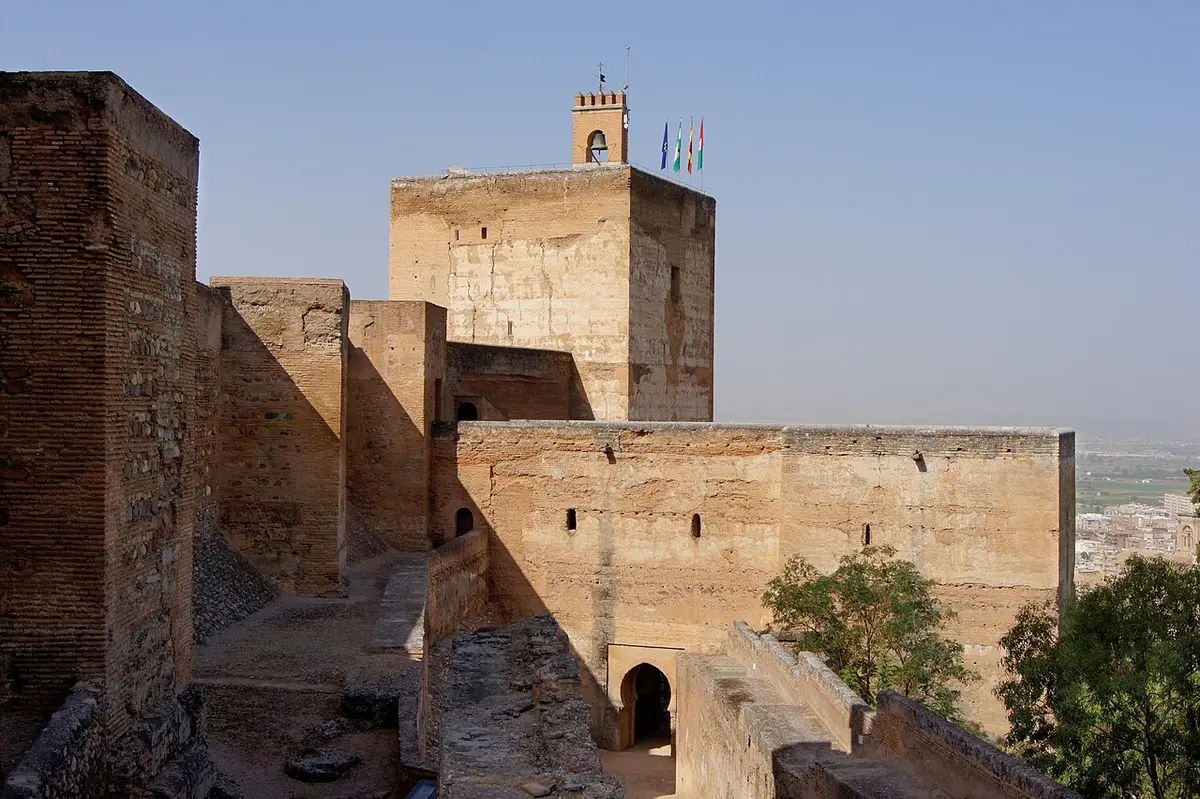 The ramparts of the Alcazaba with the square Torre de la Vela rising behind them