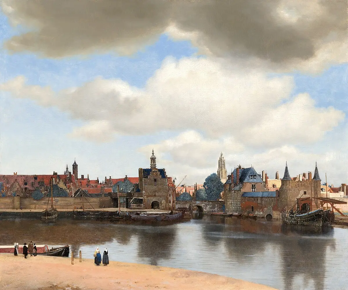 Vermeer painting of Delft seen across the water under a wide sky of clouds