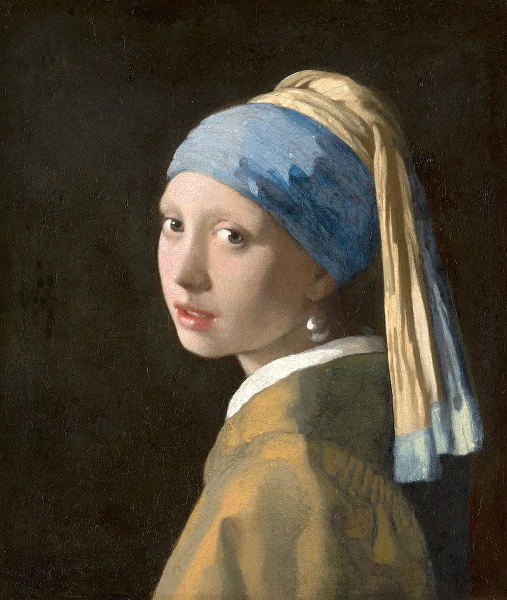 Vermeer painting of a girl in a blue and yellow turban looking over her shoulder, a pearl at her ear