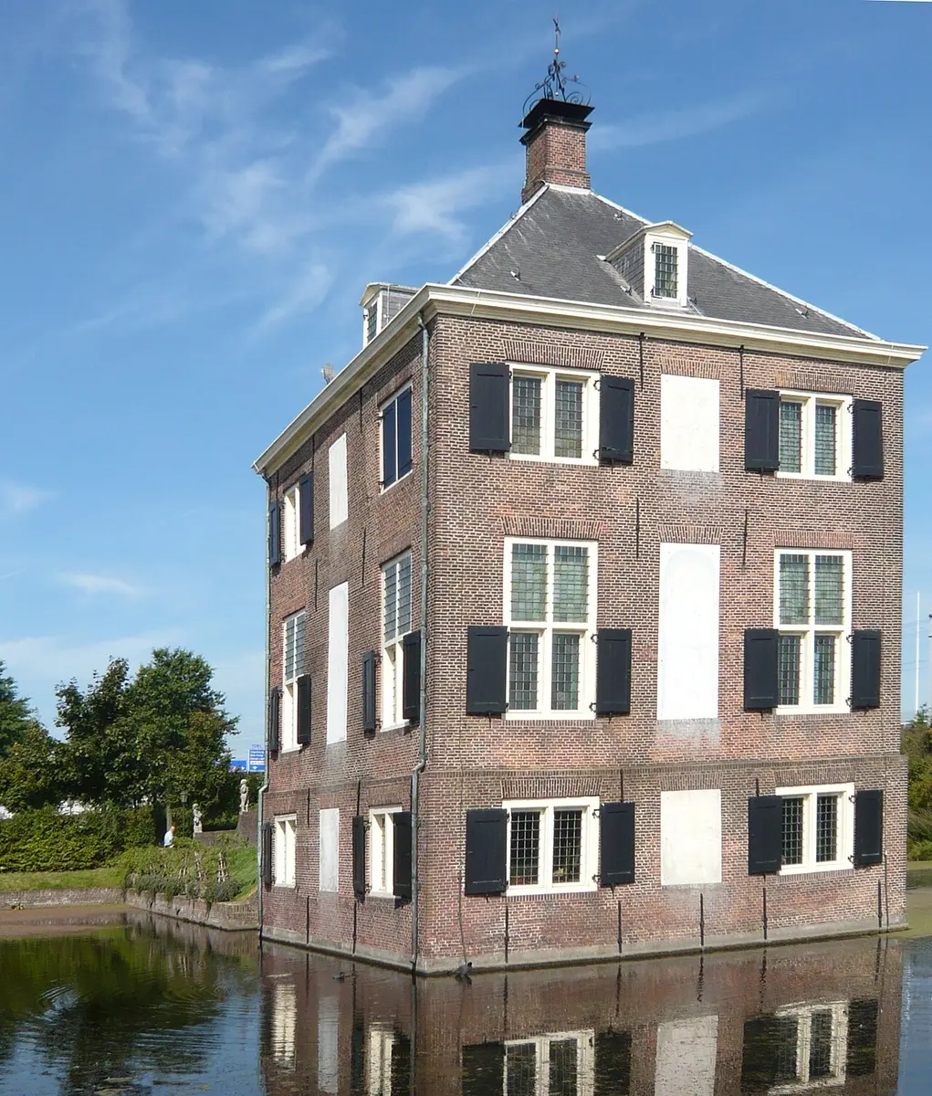 Hofwijck, a small square brick country house with white window frames and dark shutters