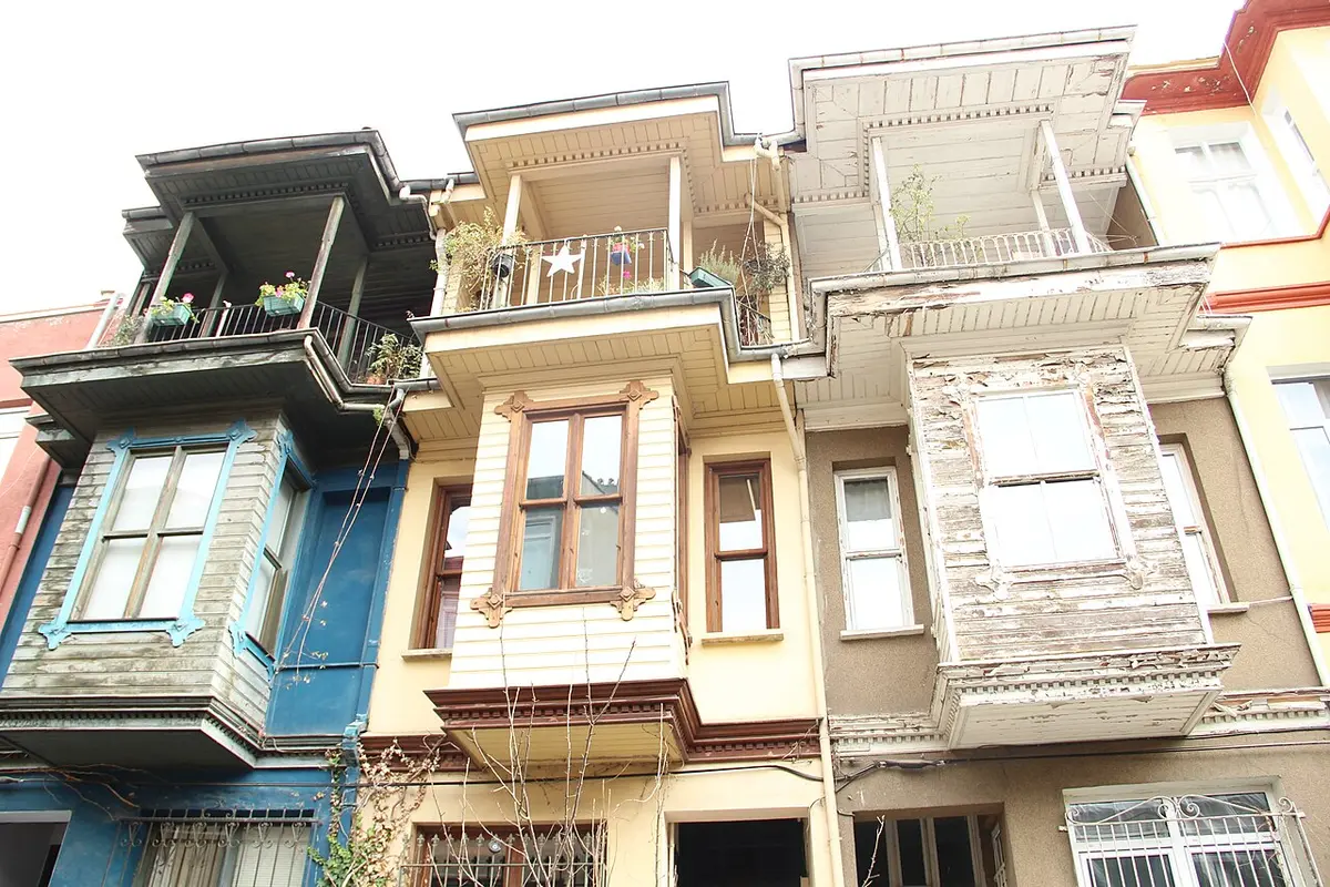 Old wooden houses with bay windows in Kuzguncuk, painted blue, cream and white