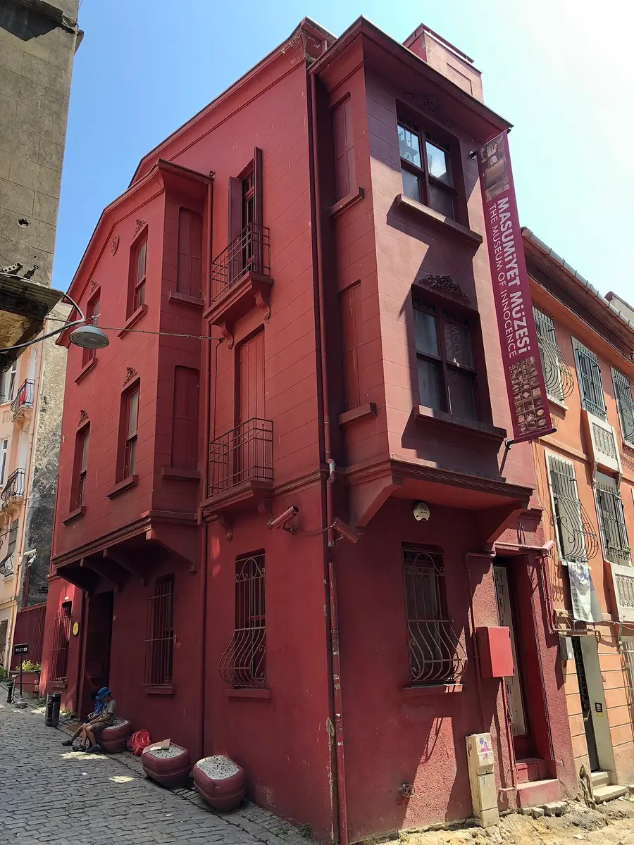 The dark red house of the Museum of Innocence on a street corner in Çukurcuma