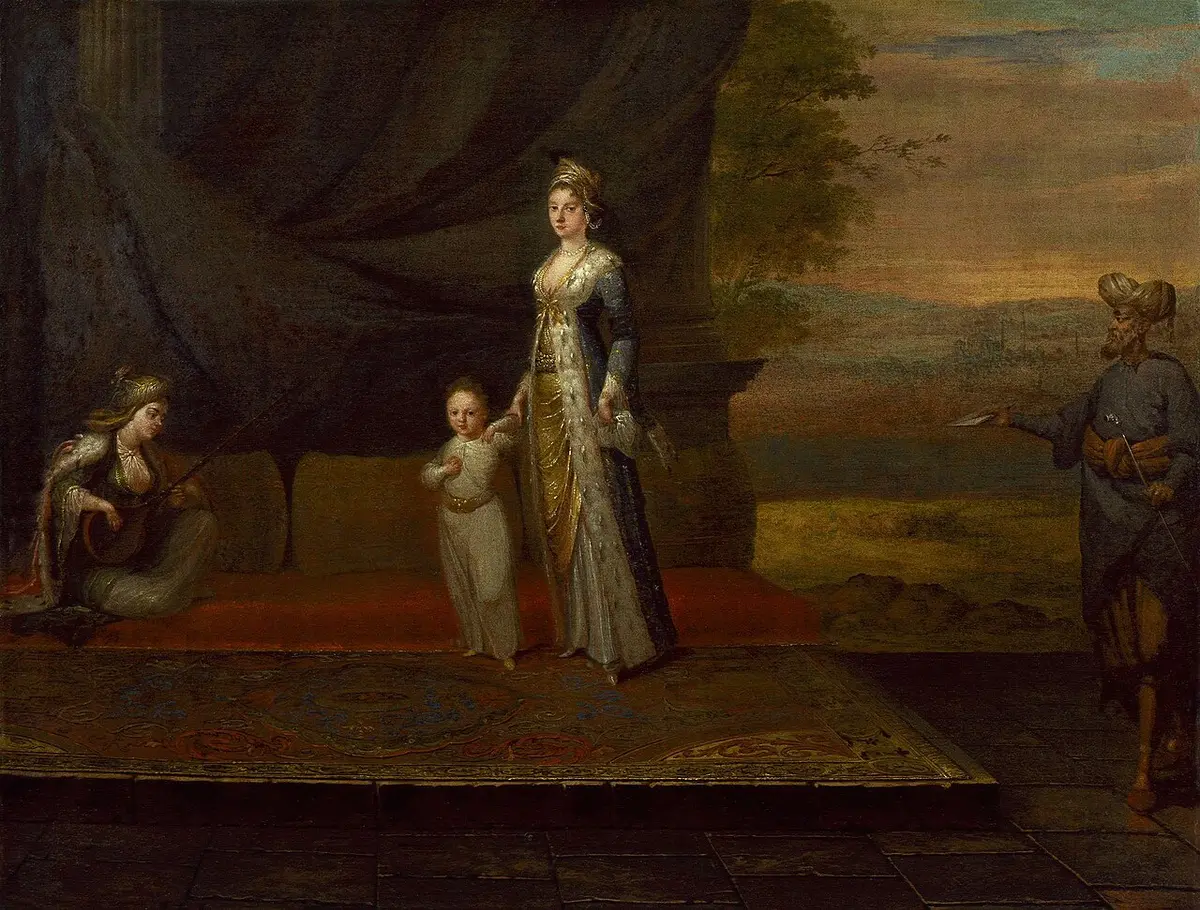 Painting of Lady Mary Wortley Montagu in Ottoman dress, holding her young son by the hand, with attendants nearby