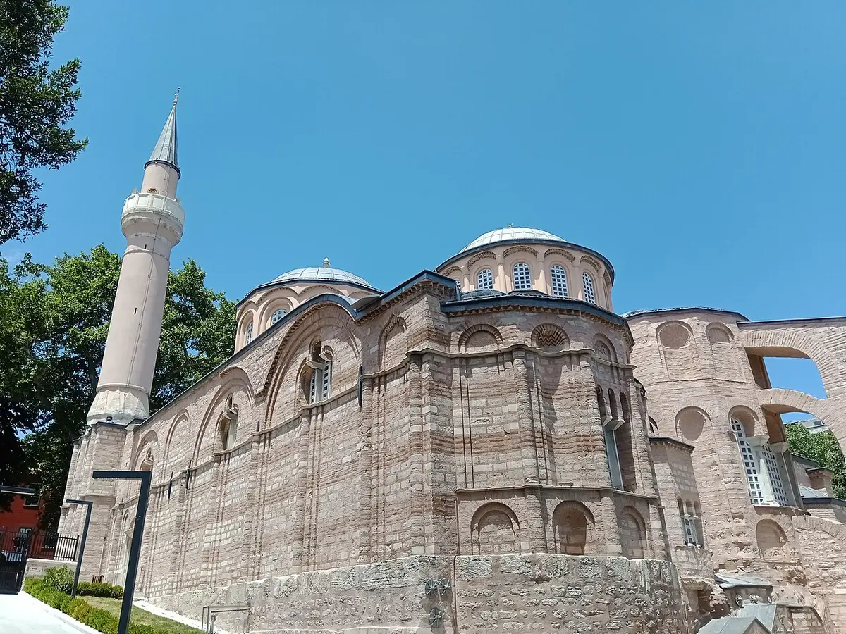 The brick walls and domes of the Kariye Mosque, the former Chora Church, beside its minaret