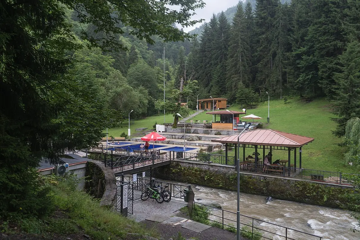 Open-air sulphur pools and a pavilion in the forest at the far end of Borjomi’s park