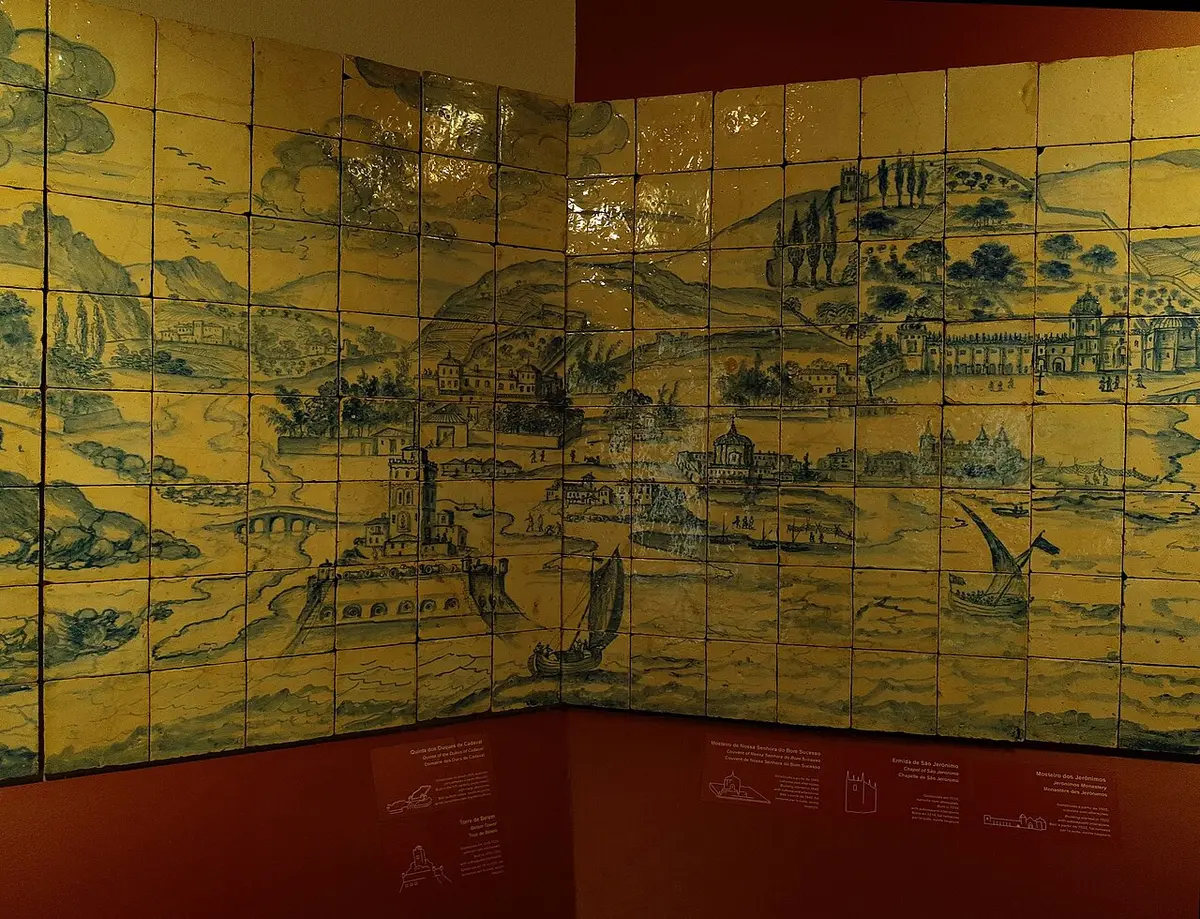 A long blue and white tile panel of Lisbon’s waterfront, set around the corner of a museum room