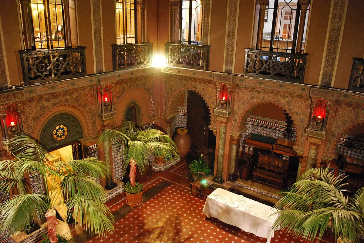The neo-Moorish courtyard of the Casa do Alentejo, with arches, tiles and palms