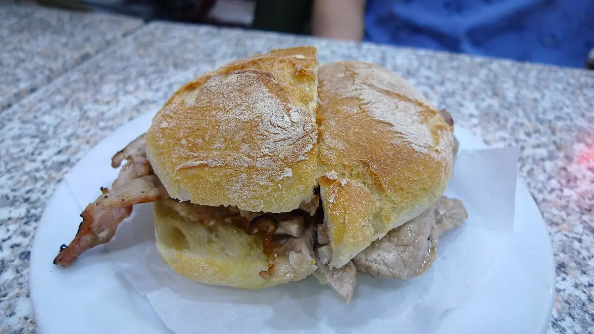 A bifana: thin slices of pork in a crusty roll