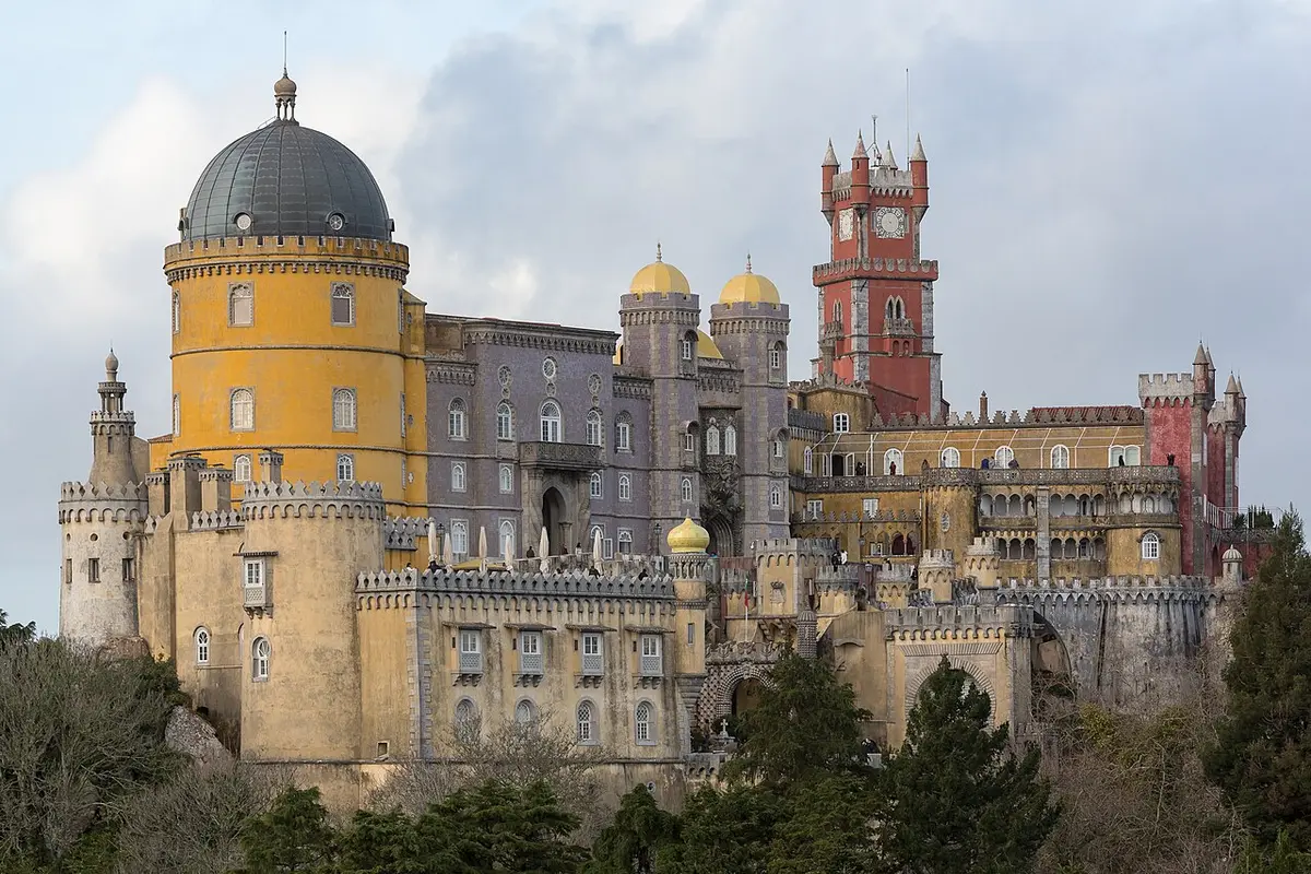 Pena Palace in Sintra, with yellow and red towers above the trees