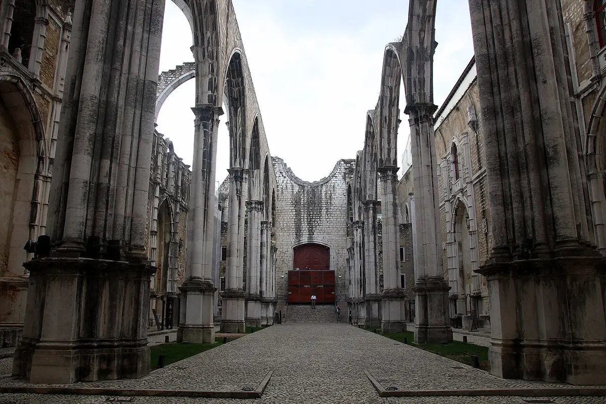 The roofless Gothic nave of the Carmo Convent, its arches open to the sky