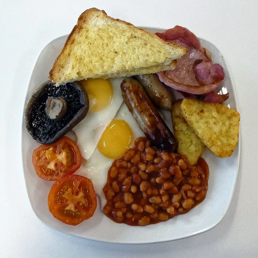 A full English breakfast of eggs, bacon, sausages, beans, tomatoes, mushroom, hash browns and toast