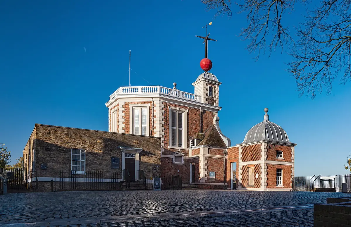 Flamsteed House at the Royal Observatory, red brick with a red time ball on a mast above the roof