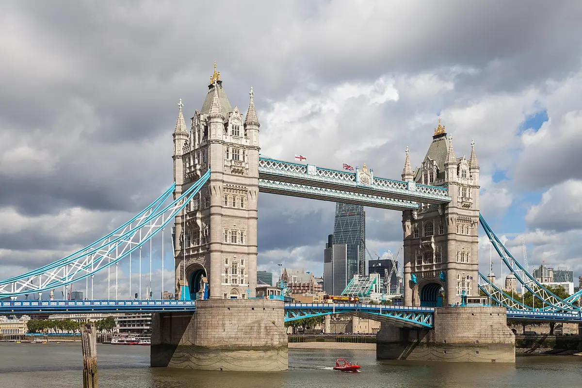Tower Bridge with its two Gothic towers and blue suspension chains over the Thames