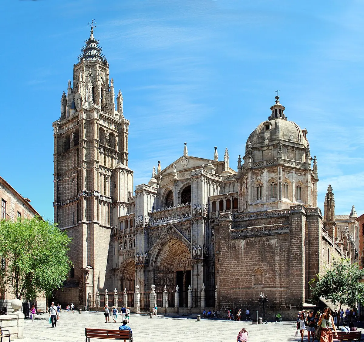 The Gothic front and tall tower of Toledo Cathedral seen from the town hall square