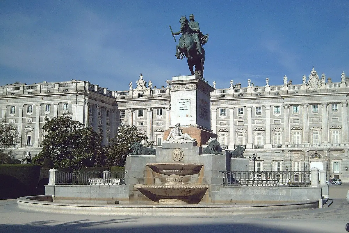 The bronze equestrian statue of Philip IV on a tall pedestal in Plaza de Oriente, with the Royal Palace behind