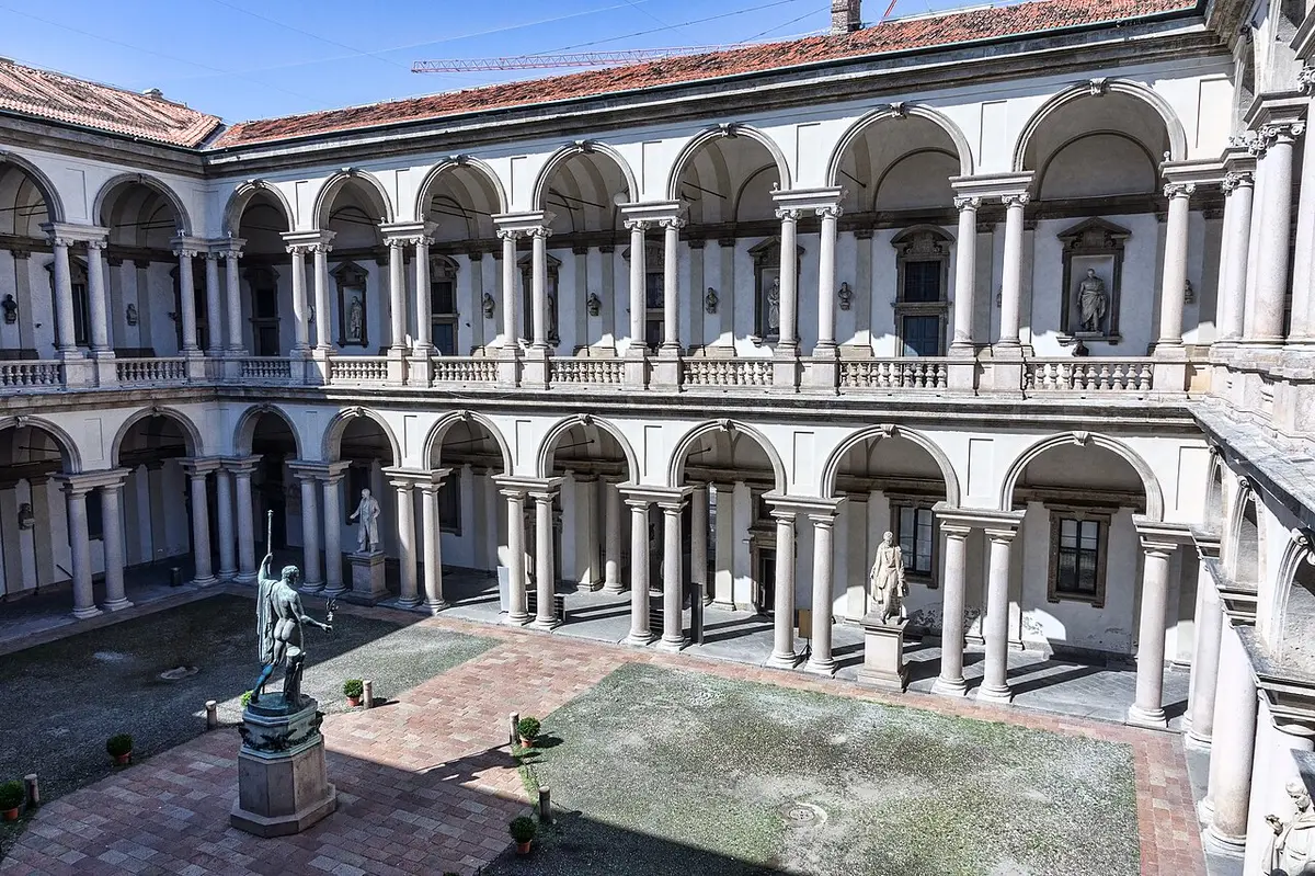 The two-story arcaded courtyard of the Palazzo di Brera, with a bronze statue of Napoleon