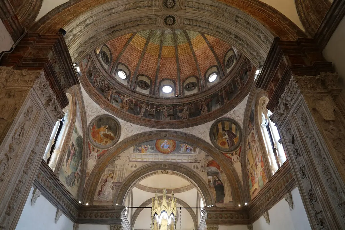 The painted dome of the Portinari Chapel, with a ring of angels and round frescoed medallions