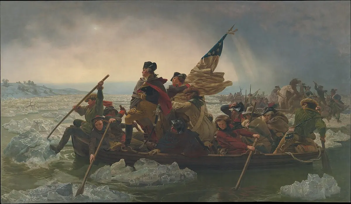 Painting of George Washington standing in a rowboat crossing an icy river with his soldiers and a flag