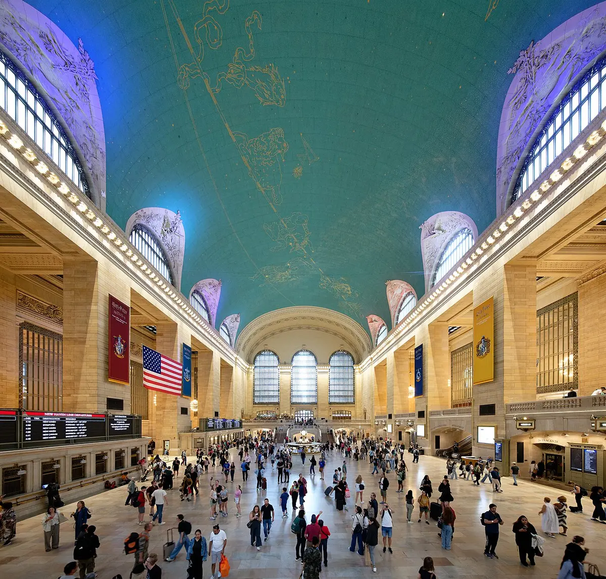 The Main Concourse of Grand Central Terminal under its green ceiling painted with constellations