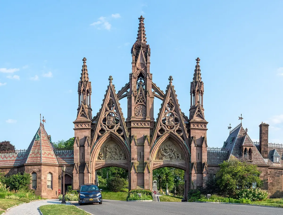 The brownstone Gothic gate of Green-Wood Cemetery, with tall spires and pointed arches