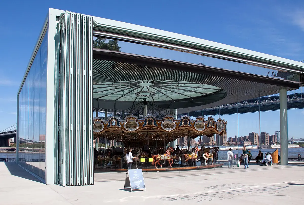 Jane’s Carousel in its glass pavilion on the waterfront, the Manhattan Bridge behind