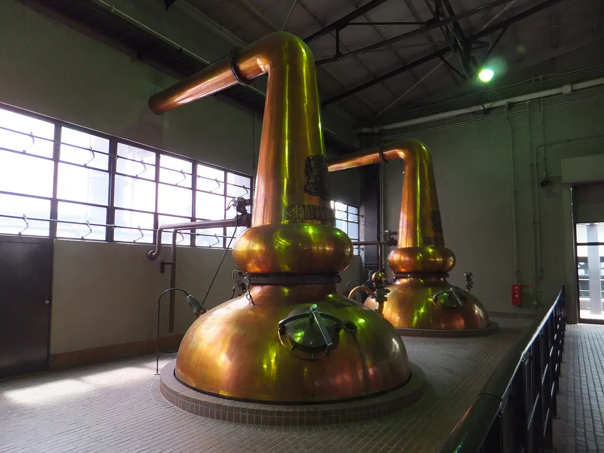 Copper pot stills in the still house of the Yamazaki distillery