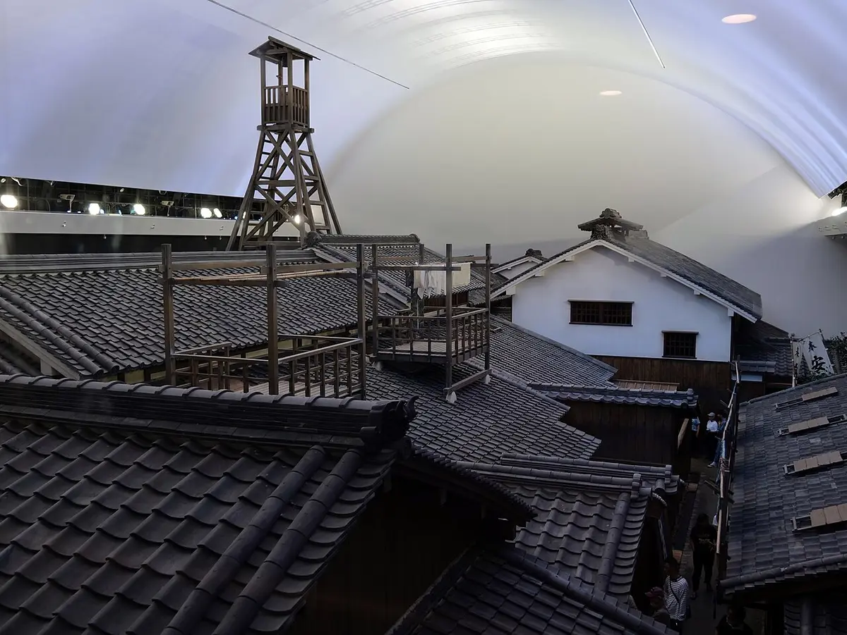 Rooftops of a full-size Edo-period street rebuilt indoors, with a fire lookout tower