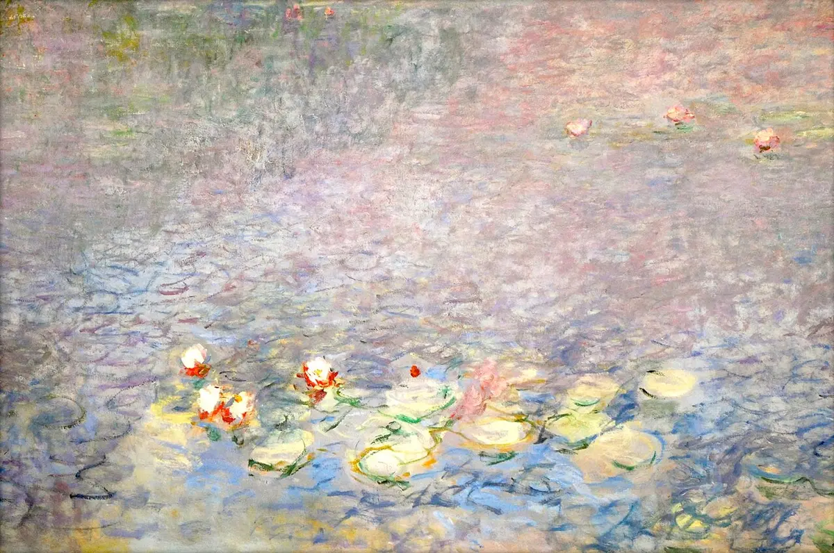 Detail of Monet’s water lilies, pink and white flowers on blue and violet water