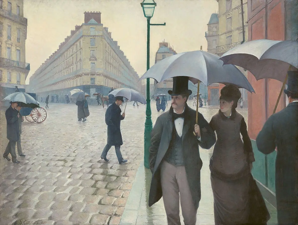 Caillebotte painting of a couple under an umbrella on a wet cobbled crossroads lined with new stone buildings