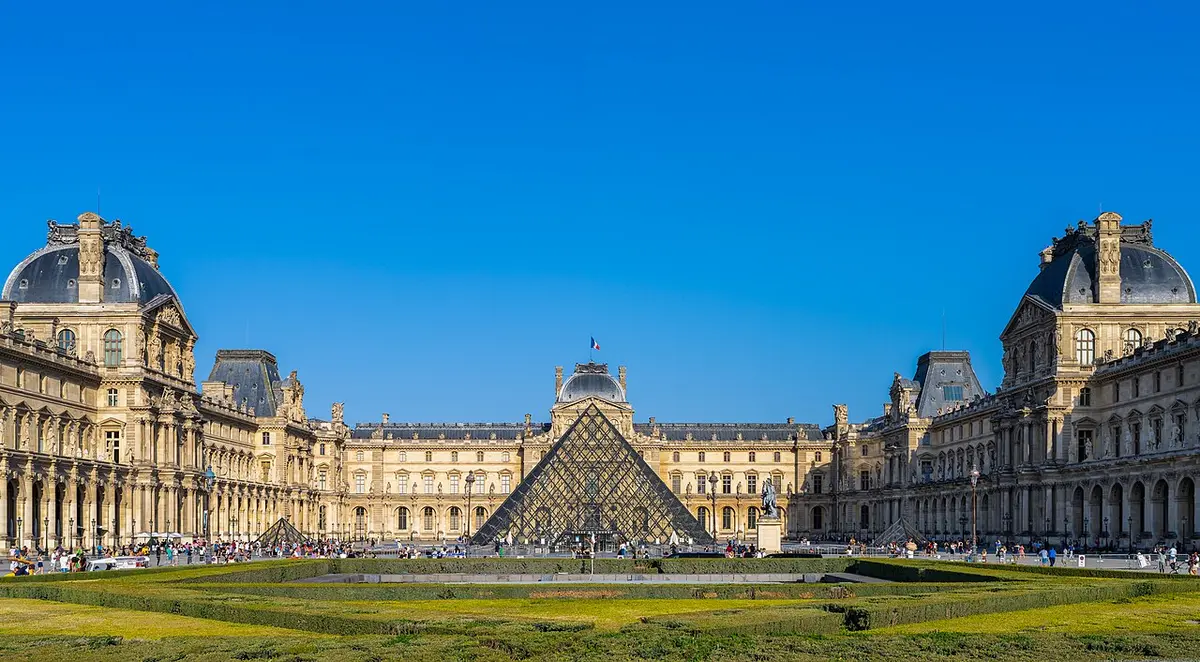The glass pyramid in the Cour Napoléon, framed by the wings of the Louvre palace