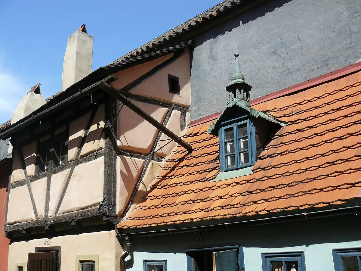 Small painted houses with steep tiled roofs along Golden Lane at Prague Castle