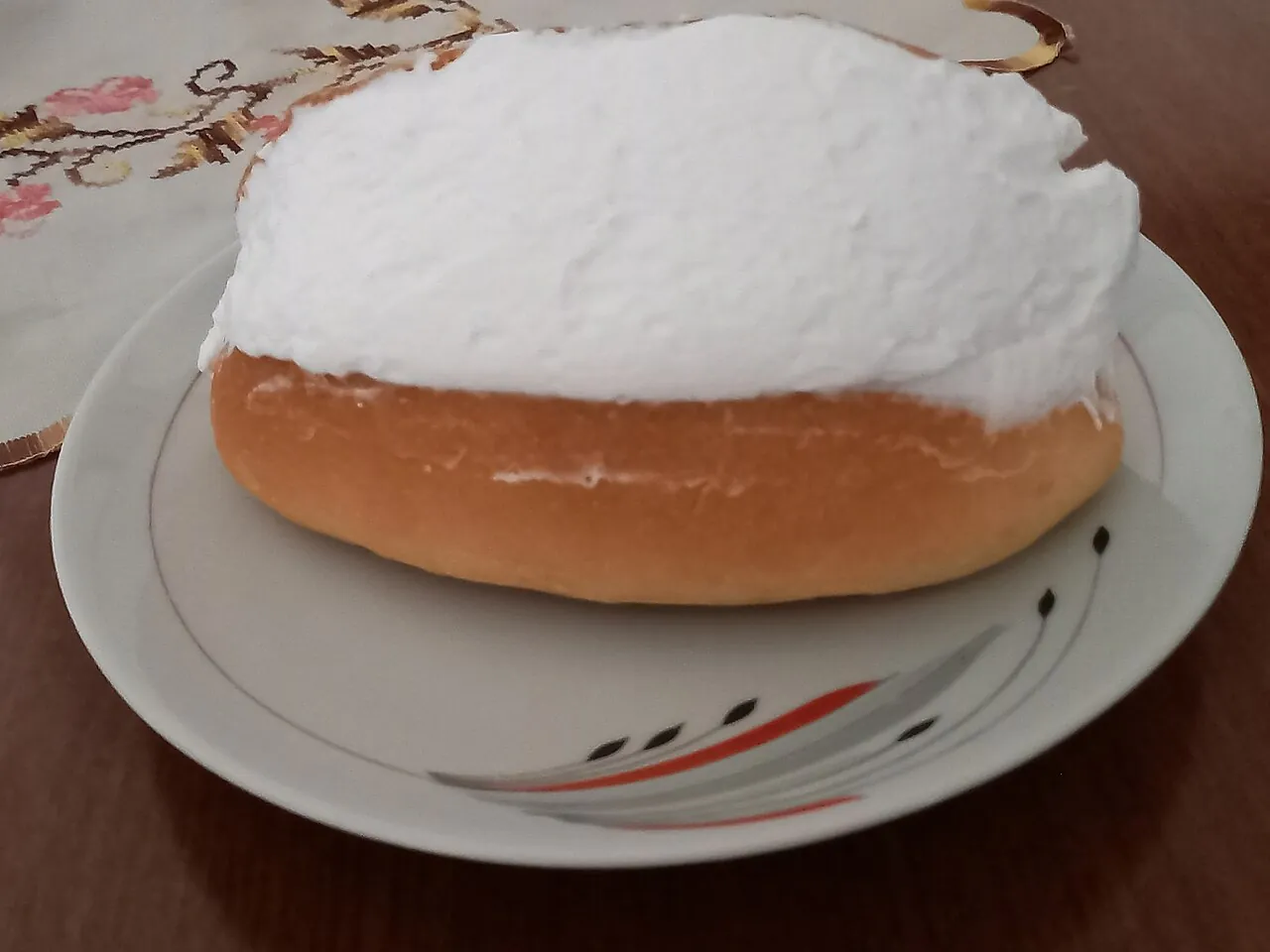 A maritozzo bun filled with whipped cream